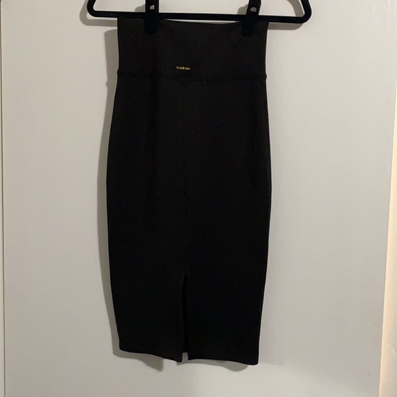 NWOT. Bebe black midi length skirt. Never worn. - Picture 4 of 6